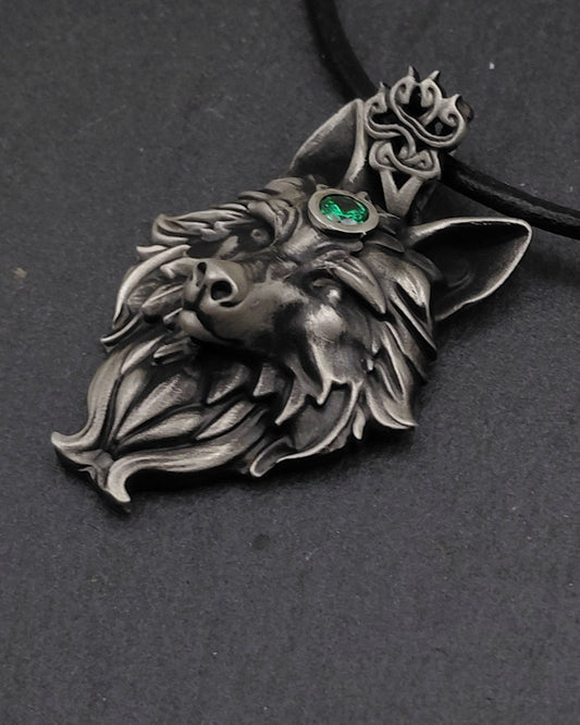 Sterling Silver Wolf head pendant with green gemstone on a black background, for fans of dogs ,  wolves, and  the Witcher 