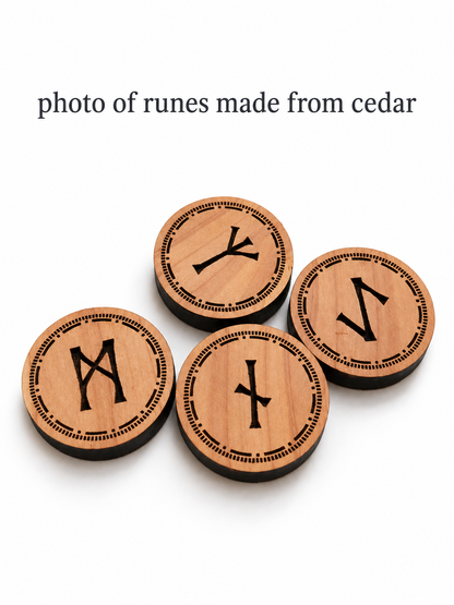 Four round cedar wooden runic tokens with engraved black symbols, arranged on a white background with the text 'photo of runes made from cedar' above them.